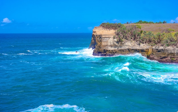 Beautiful ocean waves hitting the rocky cliffs - great for wallpapers