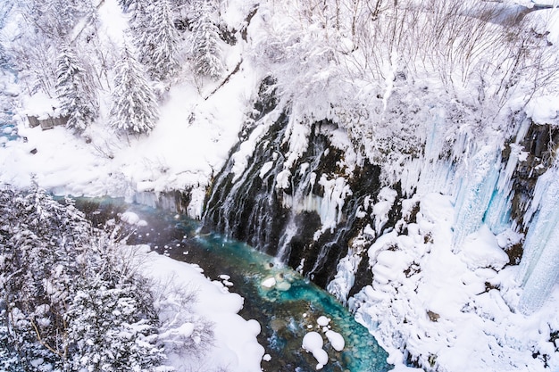 Beautiful outdoor nature landscape with shirahige waterfall and bridge in snow winter season