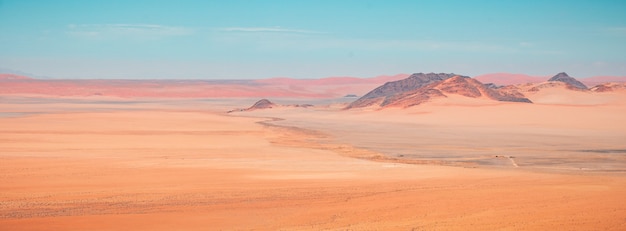 Free photo beautiful panoramic high angle shot of namib desert mountains in kanaan, namibia