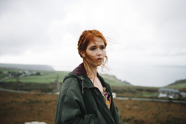 Beautiful picture of a ginger female with a pure white skin in an attractive light gown