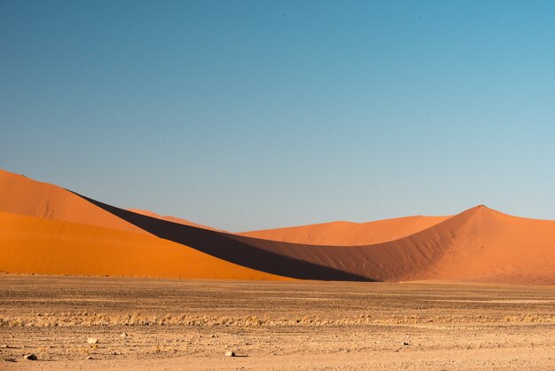 Beautiful picture of Namib National Park dunes against brown sand mountains