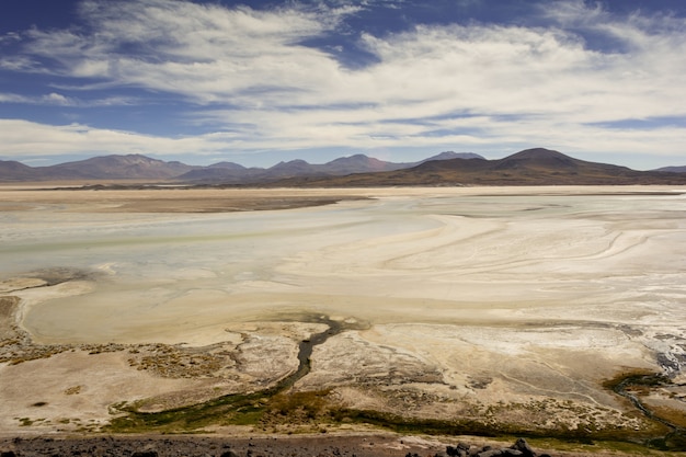 Free photo beautiful picture of salty land against mesmerizing mountains under the azure sky