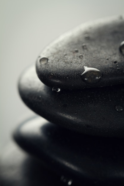 Free Photo beautiful picture of spa hot stones. dark background. closeup. wet hot stones.