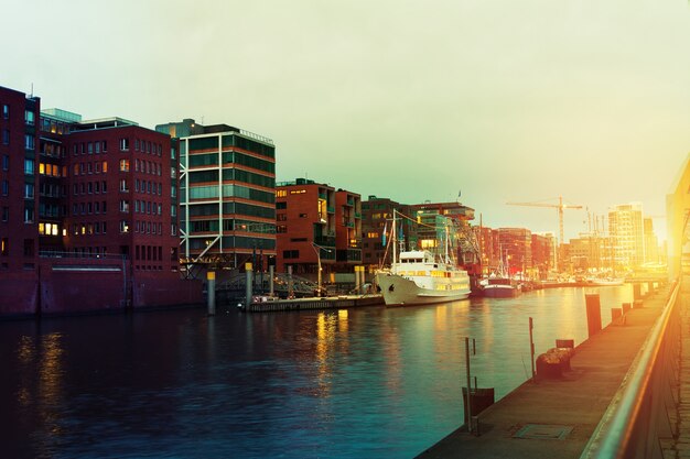 Beautiful Picture of Sunset in Port City with Water, Ships and Bridge. Toning. Hamburg, Germany.