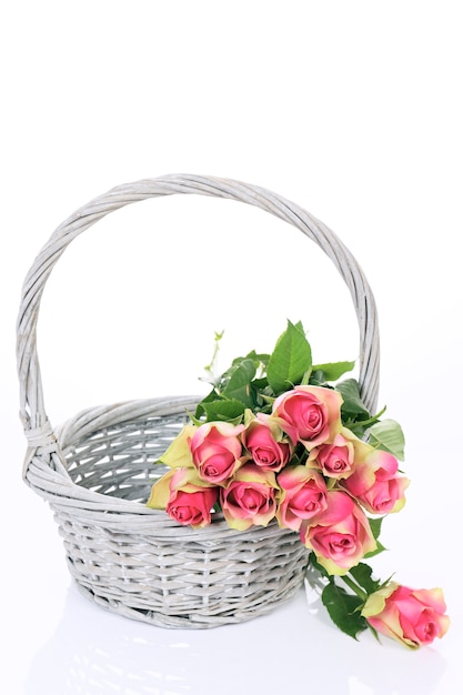 Free Photo beautiful pink roses in basket on white background