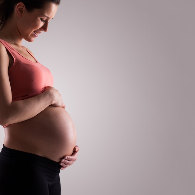 Beautiful pregnant woman isolated 