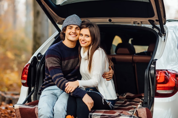 Beautiful pretty couple enjoying picnic time on the forest