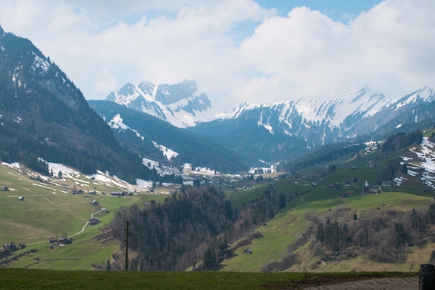 Free photo beautiful range of high rocky mountains covered with snow during daytime