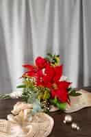 Free photo beautiful red poinsettia arrangement