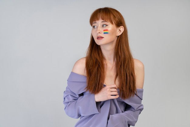 Beautiful redhead woman with rainbow symbol