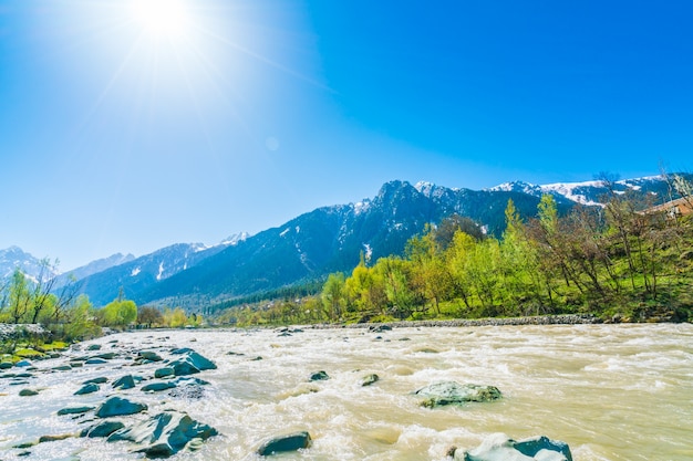 Beautiful  River and snow covered mountains landscape Kashmir state, India