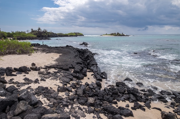 Beautiful rocky beach by the wavy ocean in Ecuador