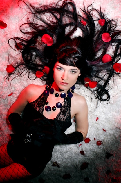 Beautiful and romantic woman with red rose