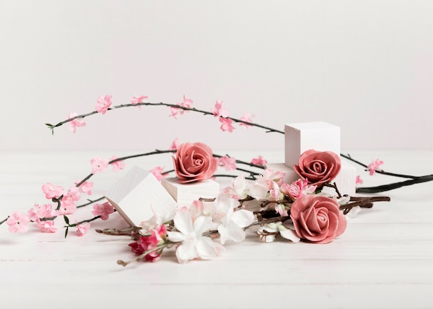 Free photo beautiful roses and flowers with white cubes