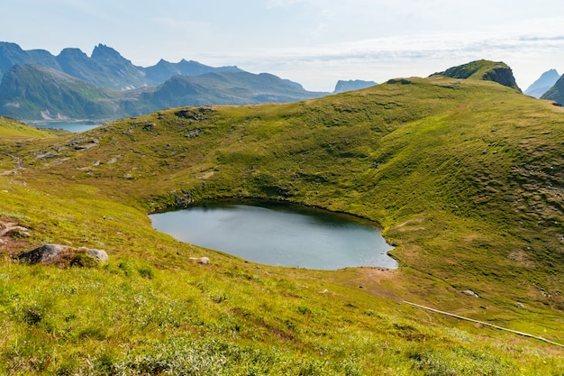 Free photo beautiful scene of a pond in lofoten islands in norway on a sunny day