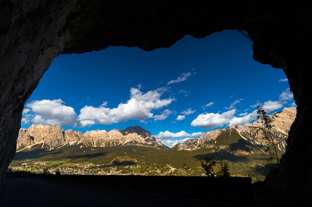 Free Photo beautiful scenery of a cave in a green landscape with a lot of cliffs