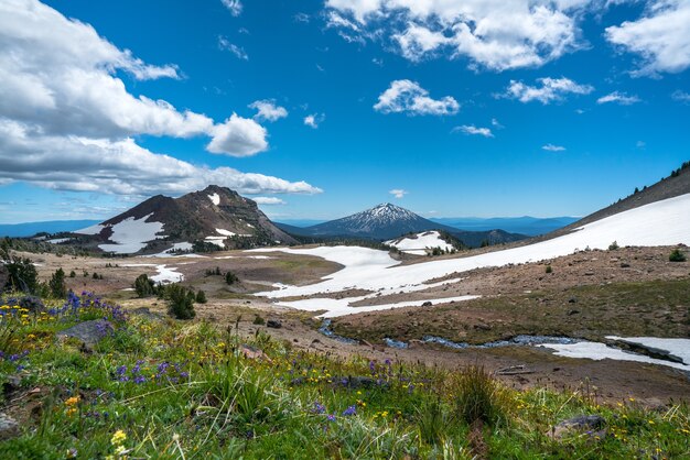 Beautiful scenery of high rocky mountains covered with snow under the breathtaking sky