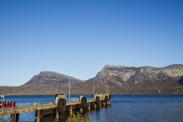 Beautiful scenery of a lake and fjords in Norway under a blue clear sky