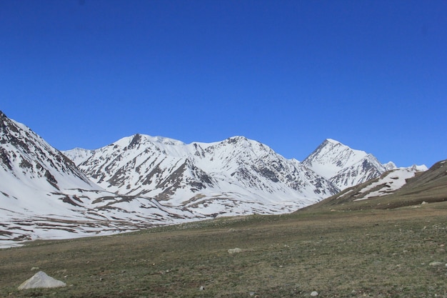 Beautiful scenery of a mountainous landscape with rocky hill covered