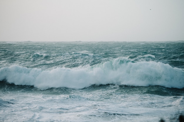 Beautiful scenery of sea waves crashing over rock formations