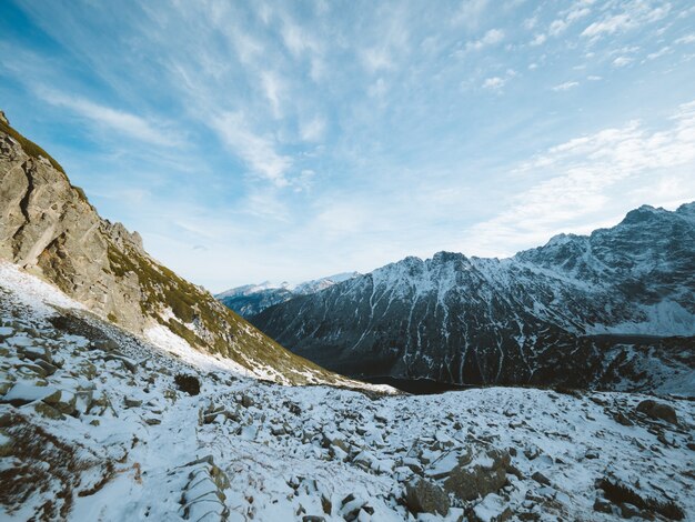 Beautiful scenery of the Tatra Mountains covered with snow under a cloudy sky in Poland