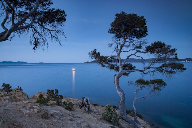 Beautiful scenery with an early morning fishing boat off the coast of Provence near Le Lavandou