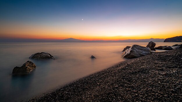 Beautiful seascape at sunset with rock formations in the water