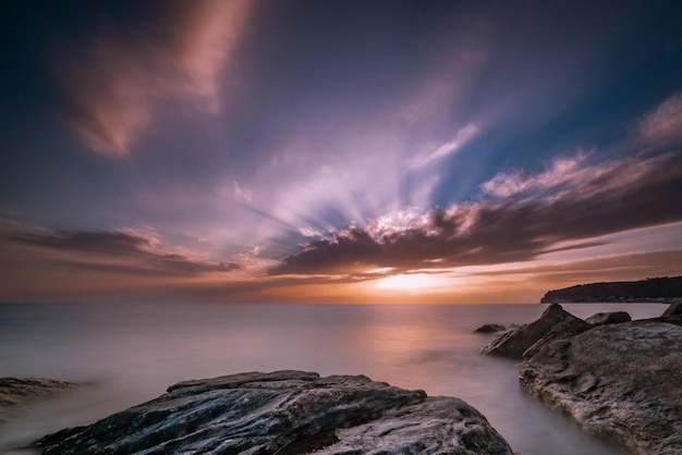 Beautiful seascape at sunset with rock formations in the water