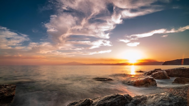 Beautiful seascape at sunset with rock formations in the water