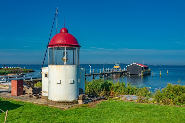 Beautiful seascape view with a small lighthouse at Marken, the Netherlands