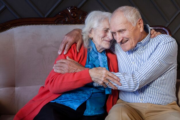 Beautiful senior man and woman hugging