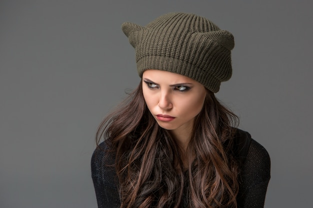 Beautiful sexy young woman in a funny hat with ears