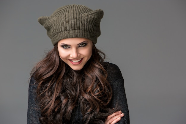 Beautiful sexy young woman in a funny hat with ears