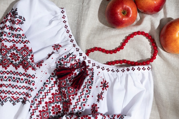 Free Photo beautiful shirt with red embroidery and apples