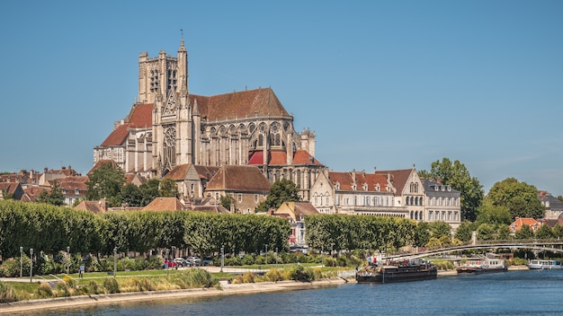 Free photo beautiful shot of the auxerre cathedral near the yonne river on a sunny afternoon in france