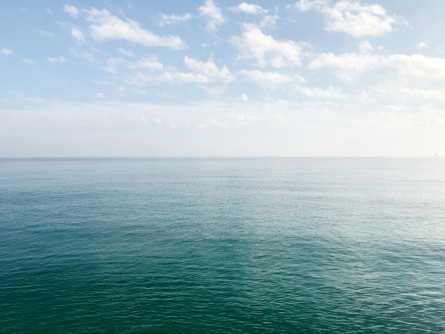 Free photo beautiful shot of a blue sky over a sea in the morning