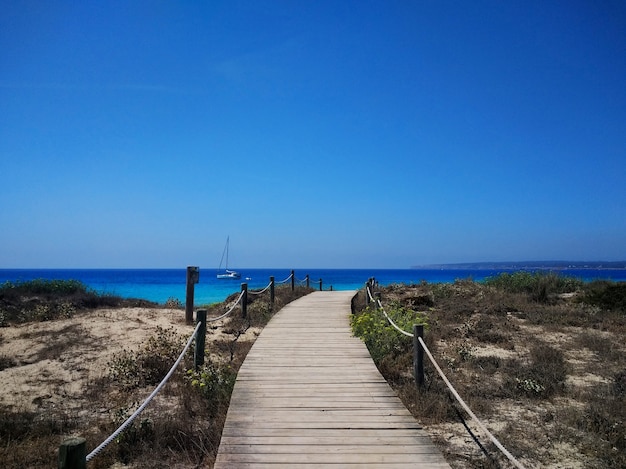 Free Photo beautiful shot of the boardwalk next to a beach in formentera, spain