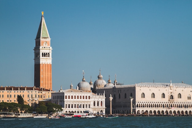 Beautiful shot of buildings and boats in the distance in Venice Italy Canals