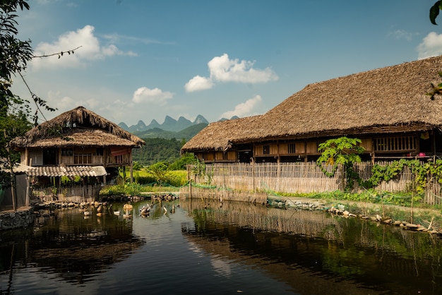 Free photo a beautiful shot of buildings near the pond under a blue sky