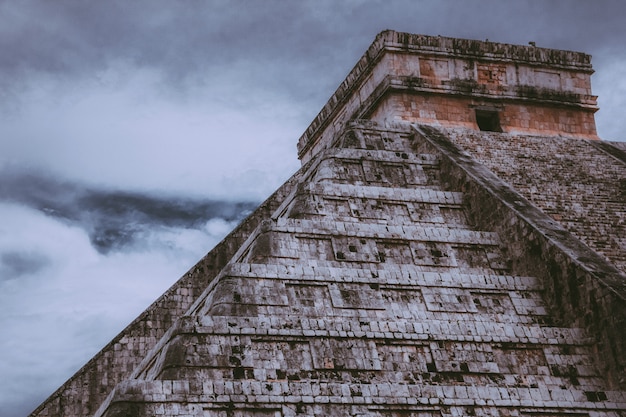 Beautiful shot of the Chichen Itza with cloudy sky 