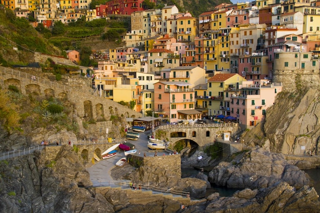 Beautiful shot of the cute town of Manarola with colorful apartment buildings