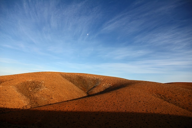 Free Photo beautiful shot of deserted hills under a blue sky at daytime