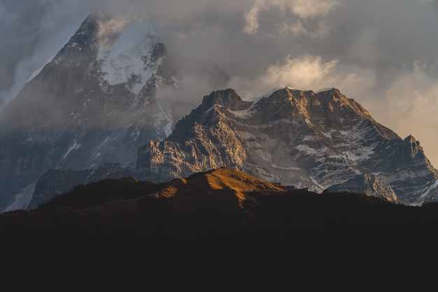 Beautiful shot of the Himalayas mountains in clouds