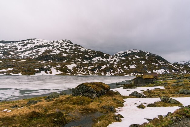 Beautiful shot of houses with a snowy  landscape  in the in Norway