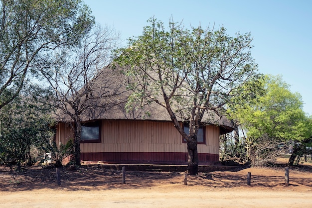 Beautiful shot of a huge african hut with a clear blue sky