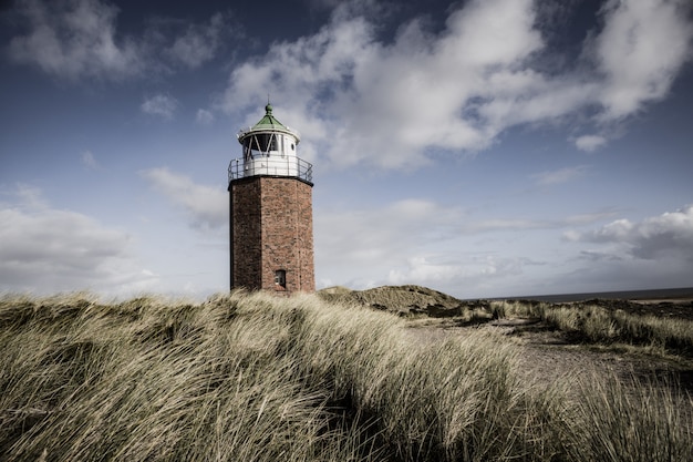 Beautiful shot of a lighthouse in the Sylt Island in Germany on a cloudy day