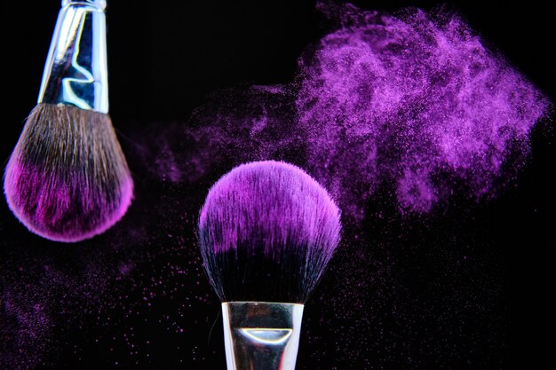 Beautiful shot of makeup brush isolated on black background