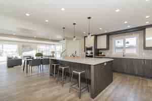 Free photo beautiful shot of a modern house kitchen and dining room