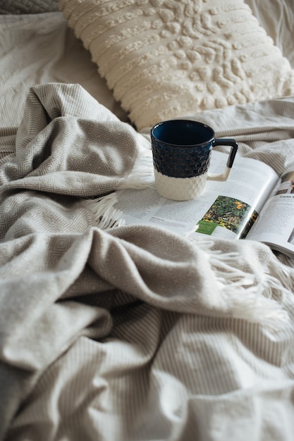 Beautiful shot of morning coffee in bed - morning laziness concept