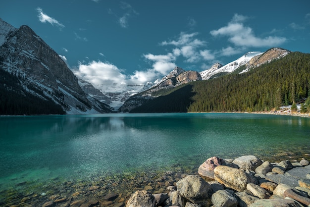 Free Photo beautiful shot of mountains reflecting in the cold lake under the cloudy sky